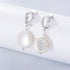 KNOT DANGLE FRESH WATER PEARL STUD EARRINGS (الأقراط)