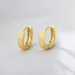 GLOSSY STRIPE ROUND HUGGIE EARRINGS (الأقراط)
