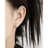 OVAL BUCKLE EARRINGS (الأقراط)