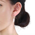 KNOT DANGLE FRESH WATER PEARL STUD EARRINGS (الأقراط)